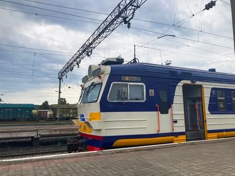 A candid image of a blue, yellow-fronted train with chevronslightning bolt de Stock Photos