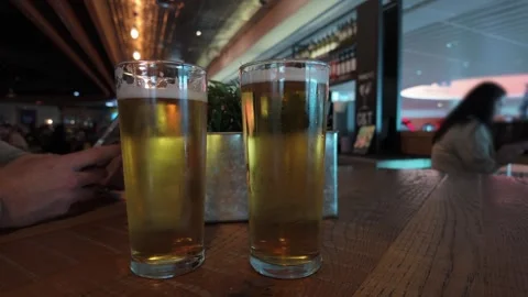 Candid Shot Of Beer Pints On A Table In Bar Stock Footage 277159099