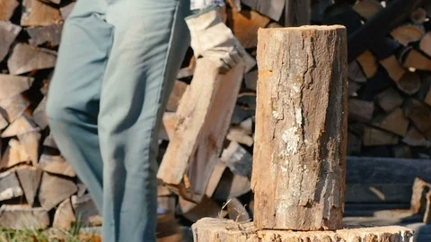 Candid Shot of an Older Man Working in Front of a Woodpile Stock Footage 85643030