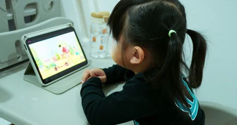 Candid shot of a young toddler using a smart device for early childhood Stock Footage 342291222