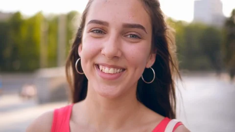 Candid young girl posing at camera outdo... | Stock Video | Pond5