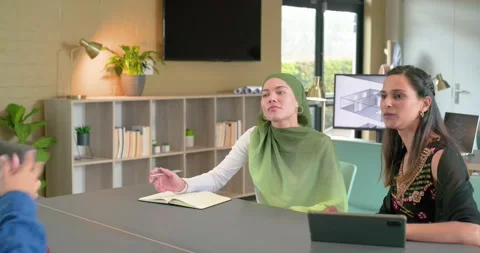 Candidate gesturing skills in office causing interview panel nodding and Stock Footage 344383307