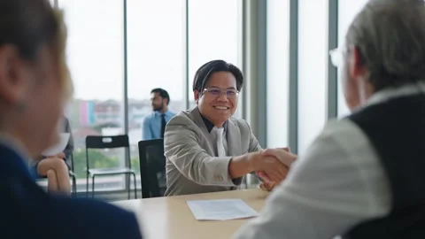 Candidate man shaking hands with human recruiters after sucessful job interview. Stock Footage 249243183