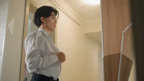 Candidate remains composed and prepares quietly in corridor. Individual calmly Stock Footage 337231729