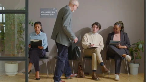 Candidates Greeting Each Other in Queue for Job Interview Stock Footage 184492186