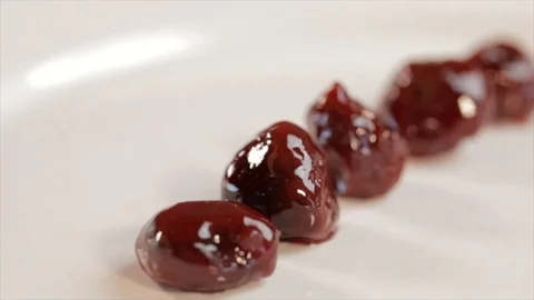 Candied Cherries in a Queue Camera Circles Around Stock Footage 99163571
