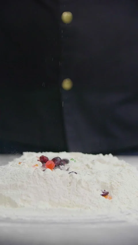 Candied Fruit and Raisins Falling Into Flour for Baking Dough 動画素材 341417563