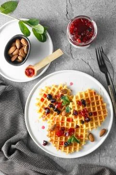 Candied fruit jelly. grapefruit marmalade with berry platter. Jar of blood or Stock Photos
