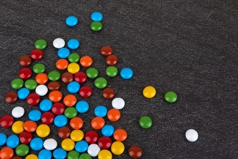 Candies on black Stock Photos