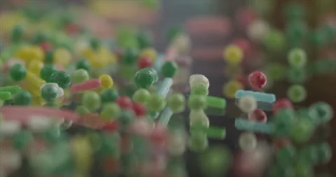 Candies fall from the side onto the mirror surface Stock Footage 198344509