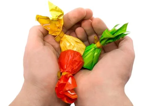 Candies in a hand Stock Photos
