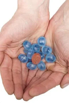 Candies in the hands Stock Photos