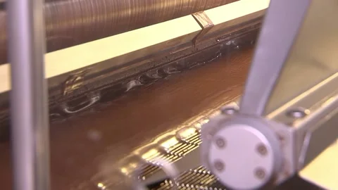 Candies pass through chocolate Stock Footage 94874319