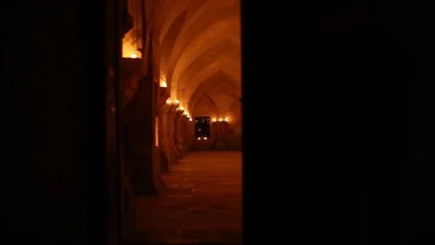 Candle along an abbey corrido Stock Footage 77268201