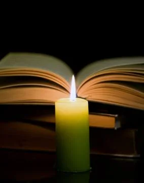 Candle and book Stock Photos