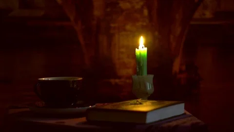 Candle and book on the table Stock Footage 95743151