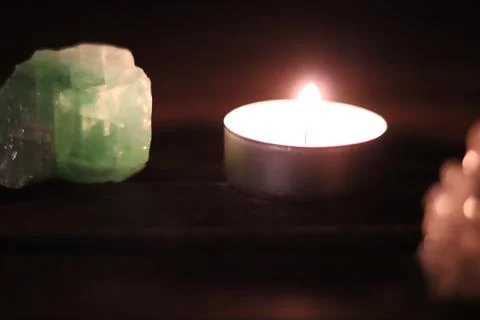 Candle and gemstone Stock Photos