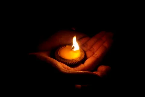 Candle and hand Stock Photos