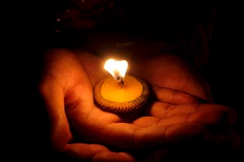 Candle and hand Stock Photos