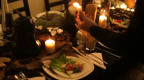 Candle and pumpkins on a table Stock Footage 57573798