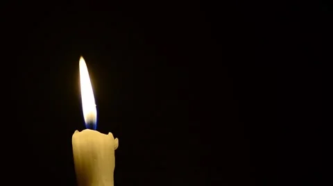 Candle and wind, blinking flame Stock Footage 48576569