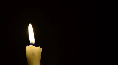 Candle and wind, blinking flame Stock Footage 48576596