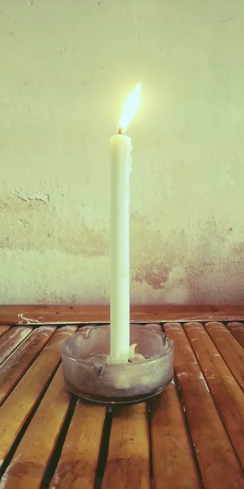 A candle in Bamboo Desk Stock Footage 213457358