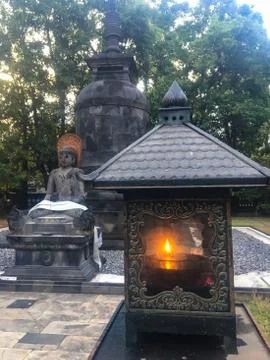 Candle in a beautiful temple in Java, Indonesia with buddha statue Fotos de archivo