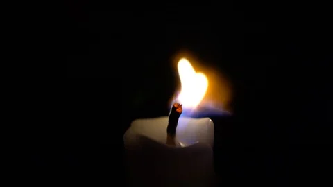 Candle Being Extinguished By a Strong Breeze Stock Footage 93319460
