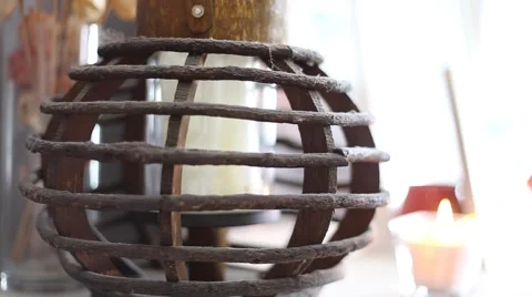 Candle being lit in background of latern Stock Footage 64221480