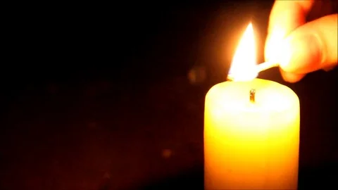 Candle being lit in the darkness Stock Footage 77862234