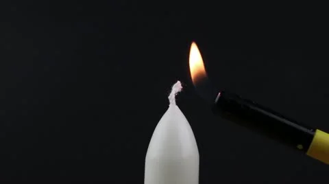 Candle being lit with a lighter Stock Footage 11068020