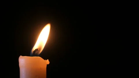 Candle on a black background close-up. Stock Footage 102242308