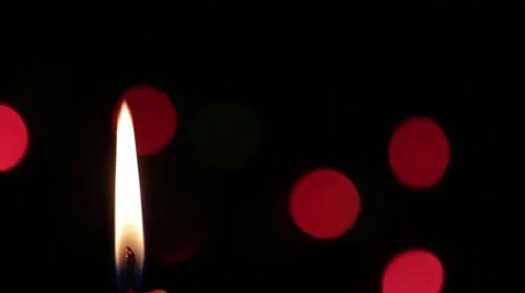 Candle with black background that is seen Christmas lights Stock Footage 59654742