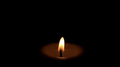 Candle on black Stock Footage