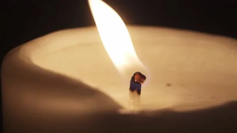Candle blown out. close-up candle on a black background fades and white smoke Stock Footage 192083157
