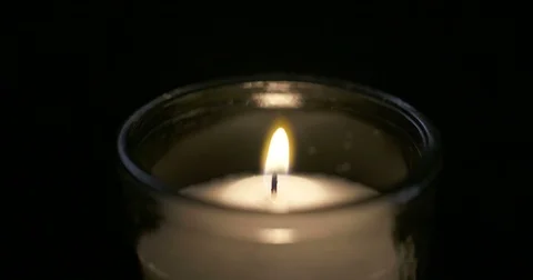 Candle blown out in macro shot Stock Footage 74349790