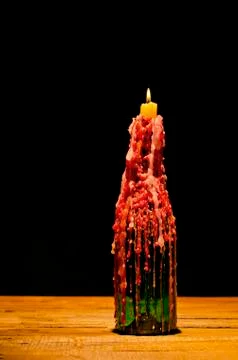 Candle on the bottle. Stock Photos