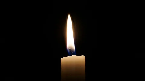 Candle burning against black background closeup Cinemagraph Stock-Footage 89411628