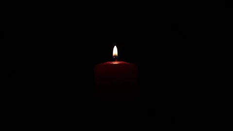 Candle burning on black background Stock Footage 83711403