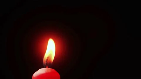 Candle burning on black background Stock Footage 151920697