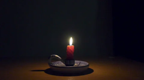 Candle burning on a candle holder Stock Footage 34857632