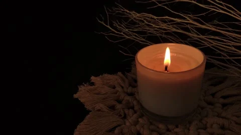 Candle burning in dark background. symbolic concept. Stock Footage 168376529