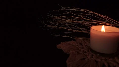 Candle burning in dark background. symbolic concept. Stock Footage 168376769