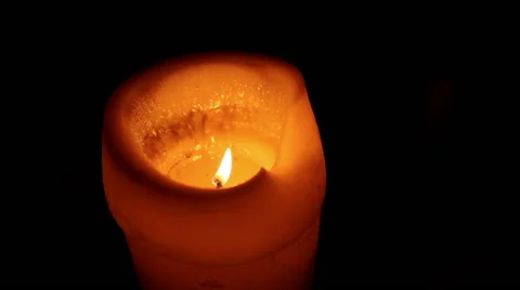 Candle burning in the dark Stock Footage 56299775