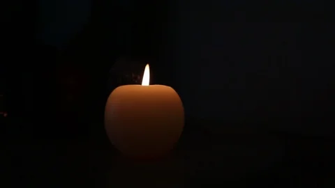 Candle burning in the dark Stock Footage 111908117