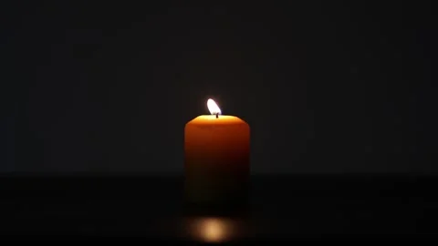 Candle burning in the dark Stock Footage 142166271