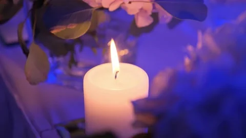 Candle is burning in a dark hall. Stock Footage 132249890