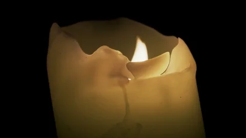 A candle is burning in the dark. The wind's blowing Stock Footage 82409579