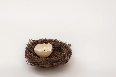 Candle burning in eggshell Stock Photos